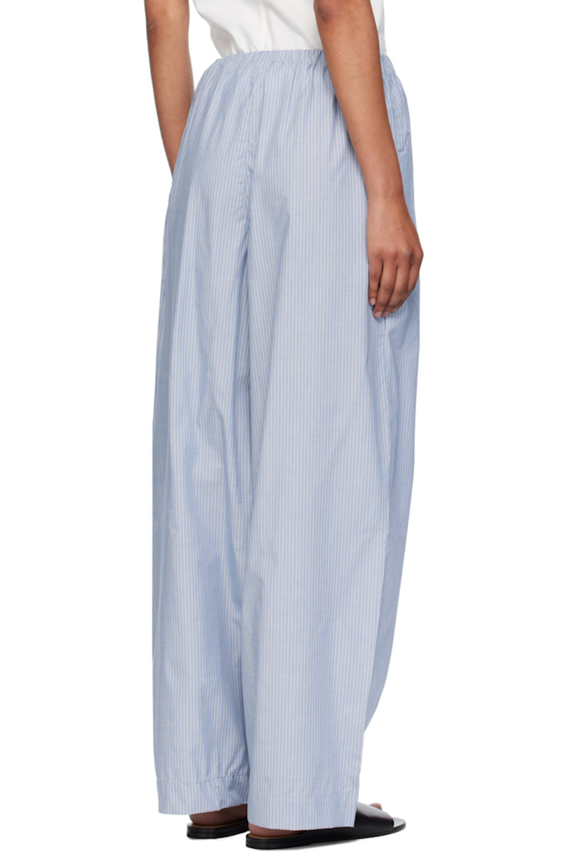 Organic cotton poplin lounge pants.

· Certified GOTS, OEKO-TEX®, and OCS 100
· Stripes throughout 
· Elasticized waistband
· Two-pocket styling
· Mock fly 

Supplier color: Blue stripe