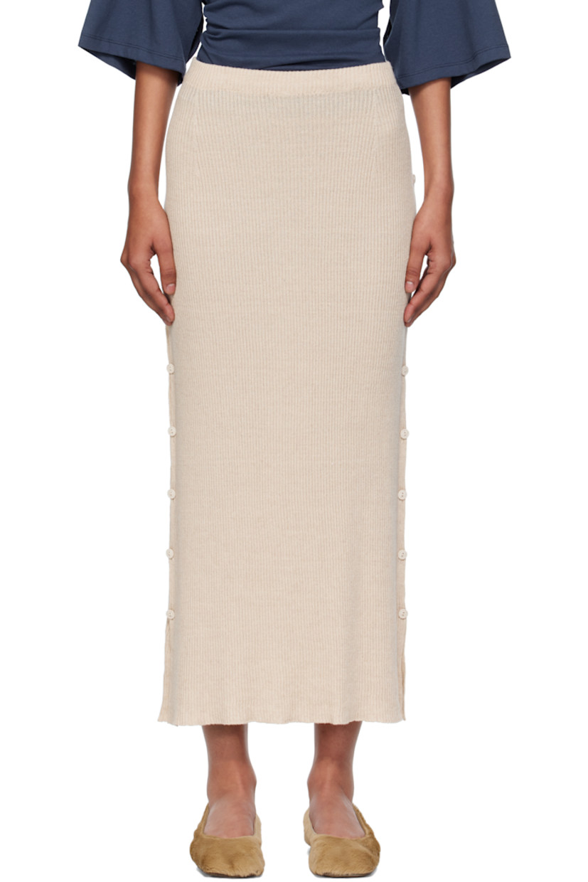Rib-knit linen- and organic cotton-blend midi skirt. 

· OEKO-TEX®-certified cotton 
· Elasticized waistband
· Buttoned vent at side seams 

Supplier color: Lata beige