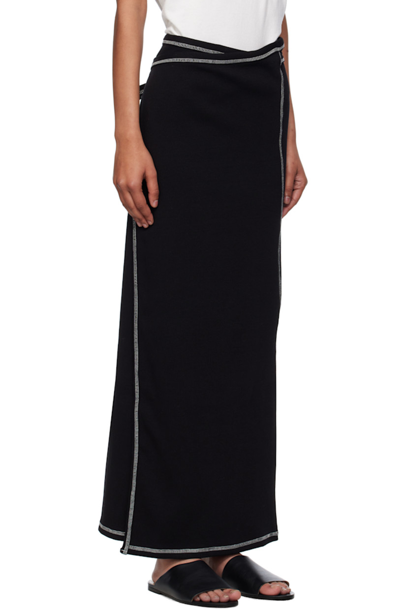 Stretch organic cotton- and recycled cotton-blend ribbed jersey maxi skirt.

· Wrap construction 
· Elasticized waistband
· Self-tie straps at waistband
· Contrast overlock stitching in white 

Supplier color: Black