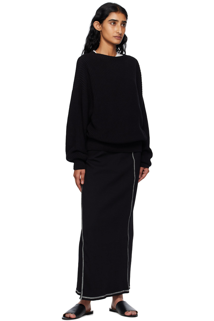 Stretch organic cotton- and recycled cotton-blend ribbed jersey maxi skirt.

· Wrap construction 
· Elasticized waistband
· Self-tie straps at waistband
· Contrast overlock stitching in white 

Supplier color: Black
