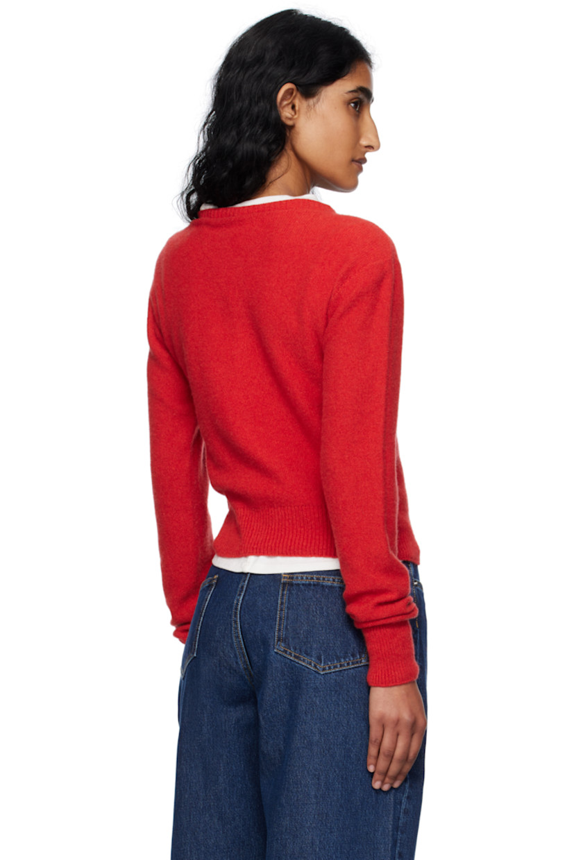 Purl-knit recycled cashmere- and wool-blend cardigan. 

· Rib-knit crewneck, hem, and cuffs
· Button closure 

Supplier color: Melograno red