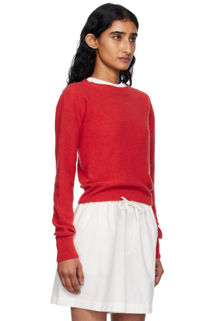 Purl-knit recycled cashmere- and wool-blend sweater. Rib-knit crewneck, hem, and cuffs.

Supplier color: Melograno red