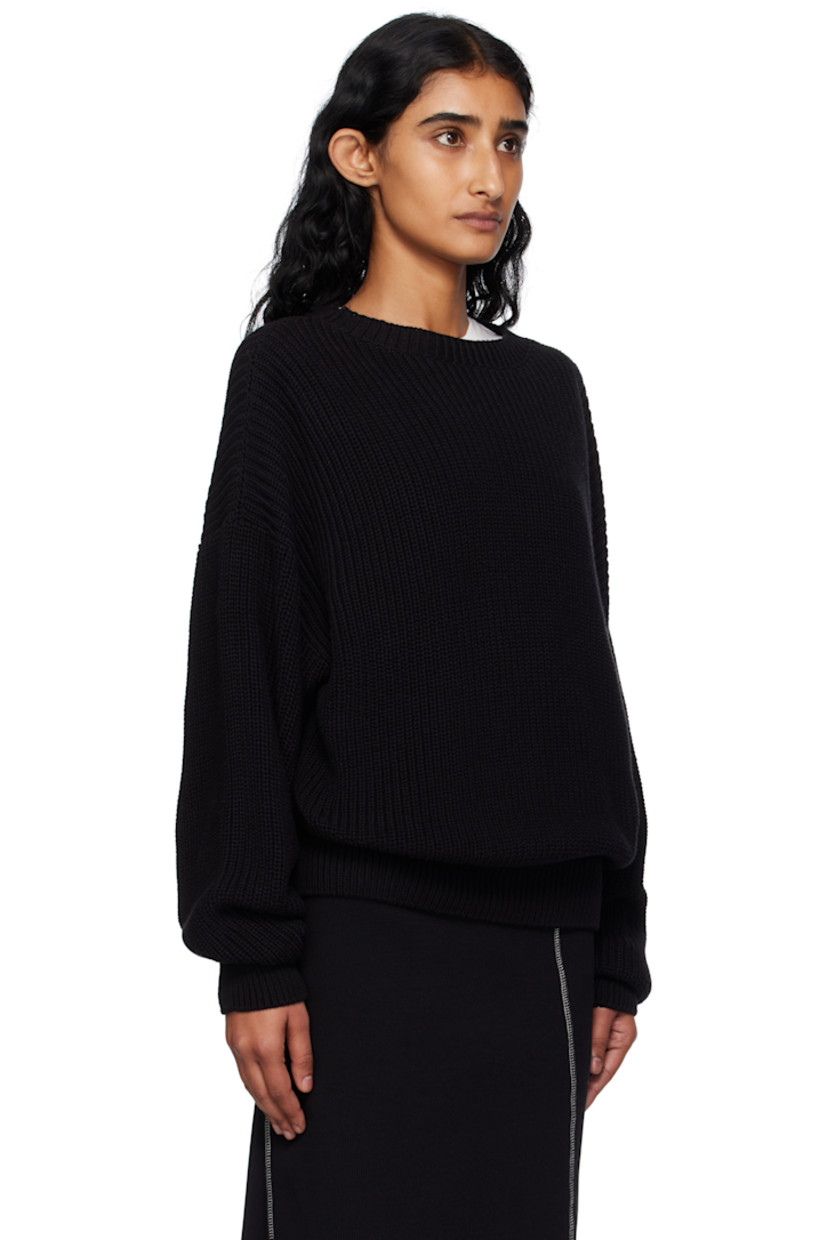 Rib-knit organic cotton sweater.

· Certified GOTS, OEKO-TEX®, and OCS 100
· Subtle distressing throughout 
· Crewneck
· Dropped shoulders

Supplier color: Black