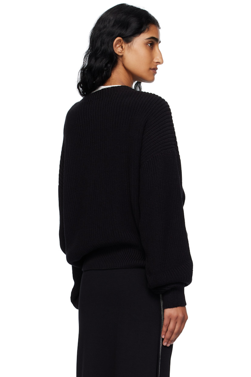 Rib-knit organic cotton sweater.

· Certified GOTS, OEKO-TEX®, and OCS 100
· Subtle distressing throughout 
· Crewneck
· Dropped shoulders

Supplier color: Black