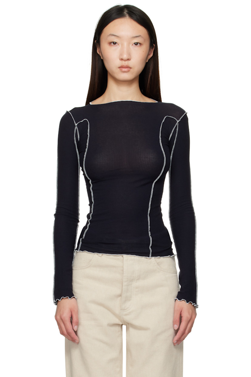 Ribbed stretch organic cotton jersey T-shirt. 

· GOTS-, OEKO-TEX®-, and OCS 100-certified
· Exposed seams throughout
· Lettuce edge at boatneck, hem, and cuffs
· Contrast stitching in white 

Supplier color: Murano navy/Undyed