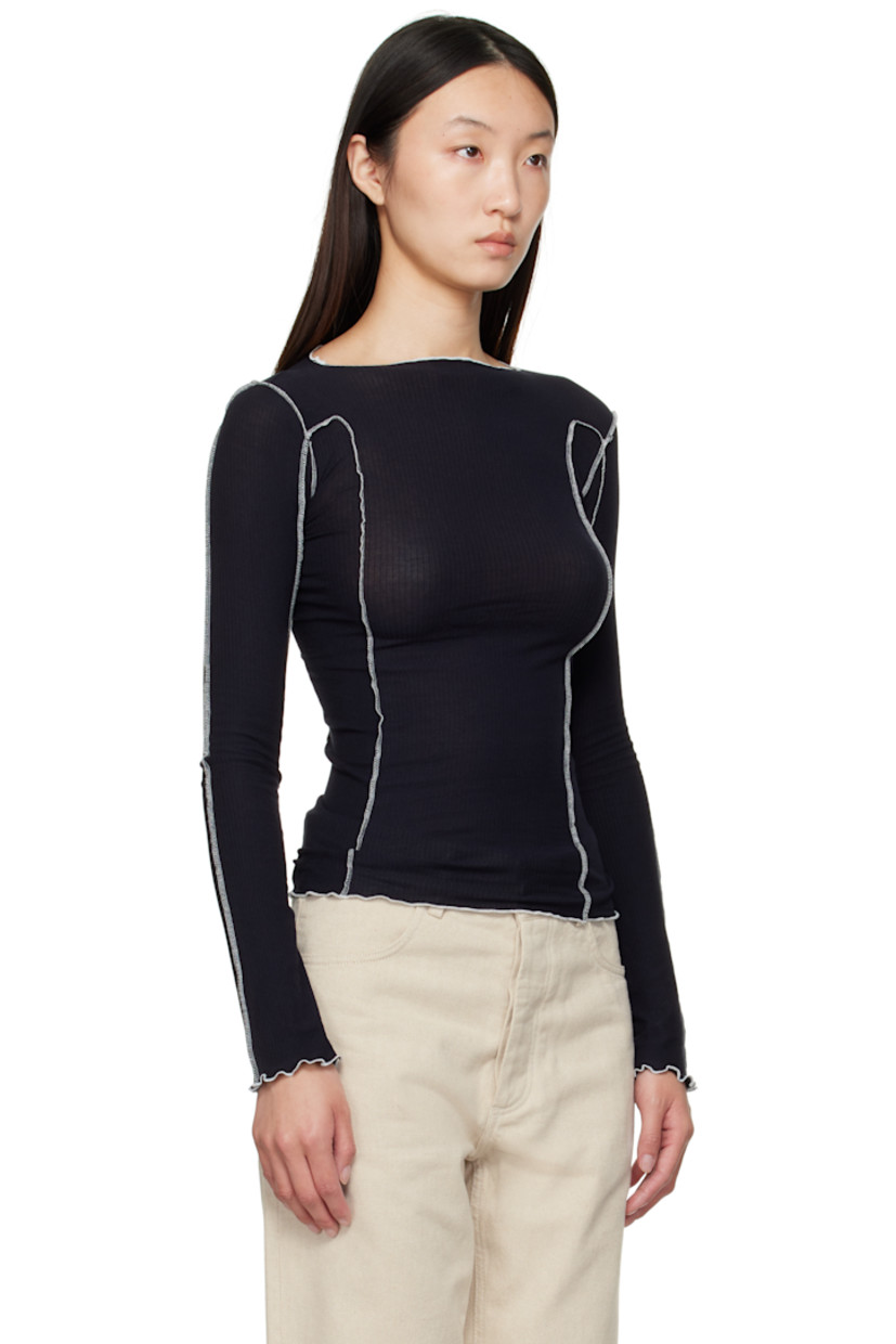 Ribbed stretch organic cotton jersey T-shirt. 

· GOTS-, OEKO-TEX®-, and OCS 100-certified
· Exposed seams throughout
· Lettuce edge at boatneck, hem, and cuffs
· Contrast stitching in white 

Supplier color: Murano navy/Undyed