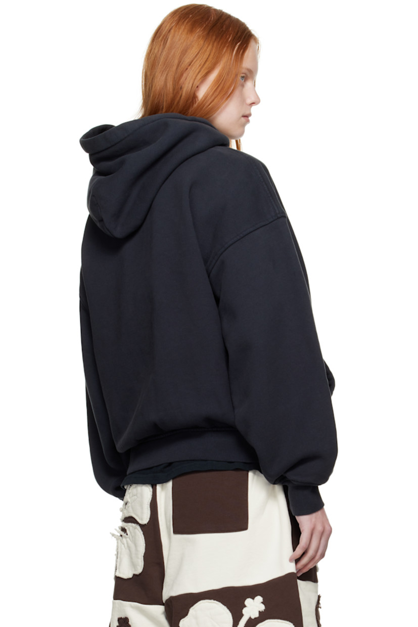 Cotton fleece hoodie. 

· Fading throughout 
· Logo, graphic, and text printed at chest 
· Kangaroo pocket
· Rib-knit hem and cuffs
· Dropped shoulders

Supplier color: Vintage black