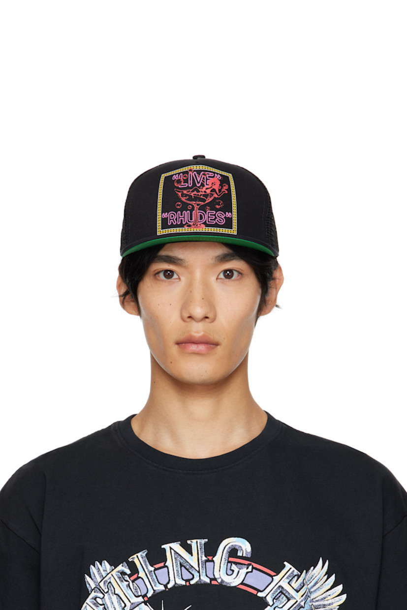 Paneled cotton twill and mesh cap.

· Embroidered eyelets at crown
· Graphic, logo, and text printed at face
· Flat brim 
· Snapback fastening at back
· Twill browband
· Plain-woven lining 

Supplier color: Black