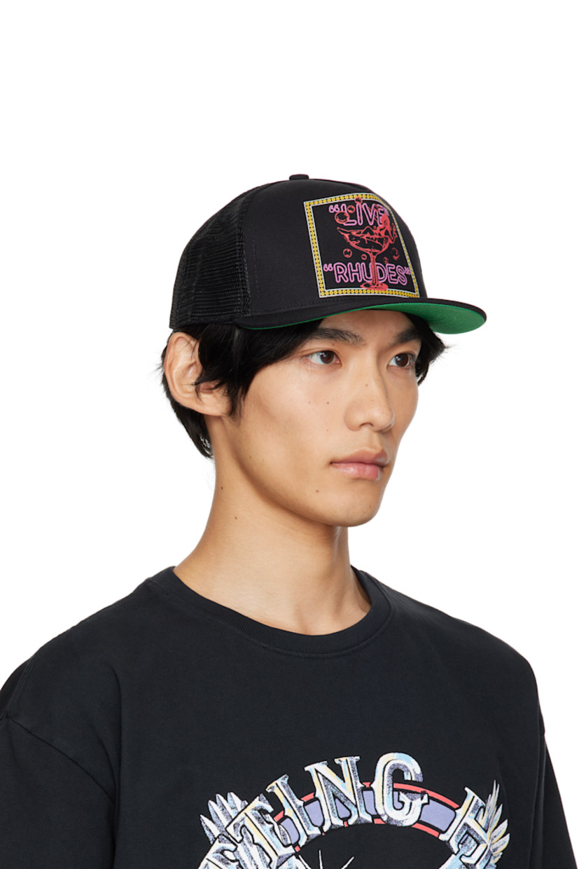 Paneled cotton twill and mesh cap.

· Embroidered eyelets at crown
· Graphic, logo, and text printed at face
· Flat brim 
· Snapback fastening at back
· Twill browband
· Plain-woven lining 

Supplier color: Black
