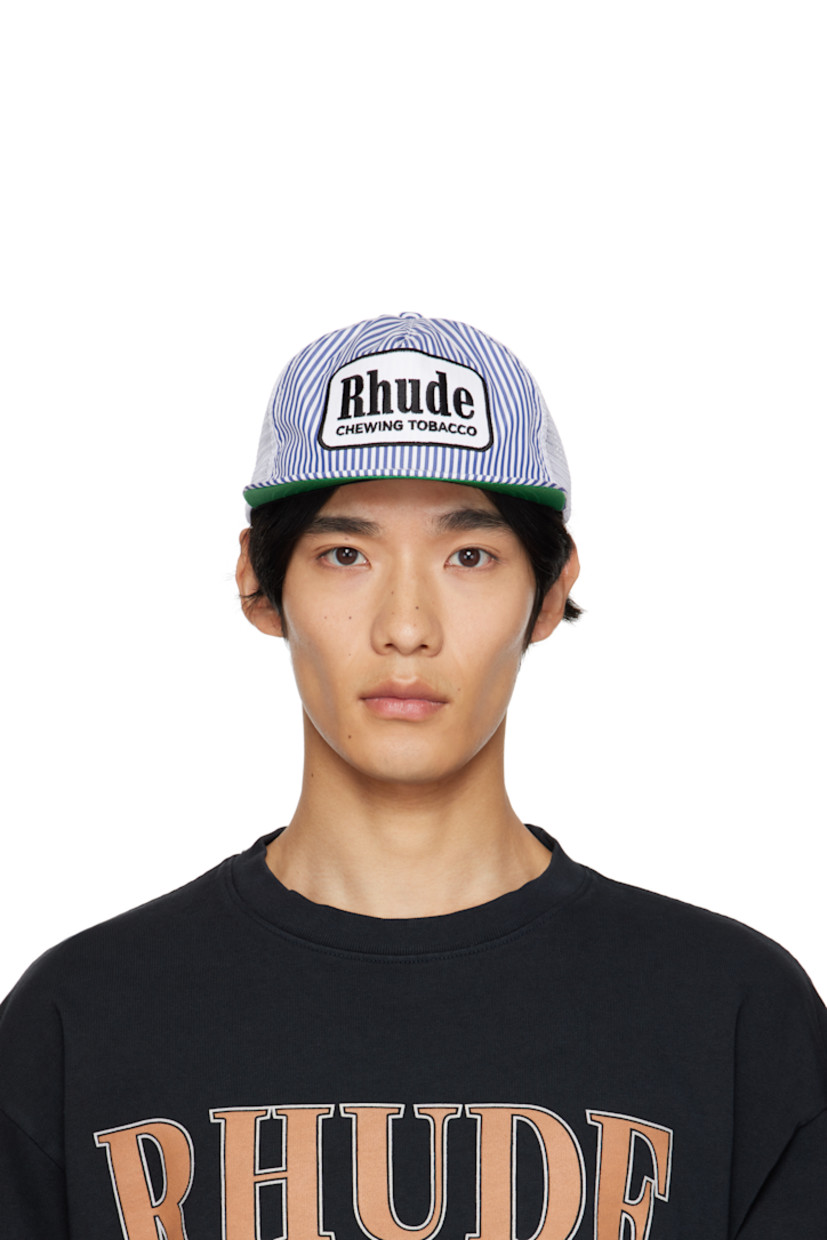 Paneled mesh and plain-woven cap. 

· Embroidered eyelets at crown 
· Stripes and embroidered logo patch at face
· Flat brim 
· Snapback fastening at back
· Twill browband
· Plain-woven lining 

Supplier color: Blue/White