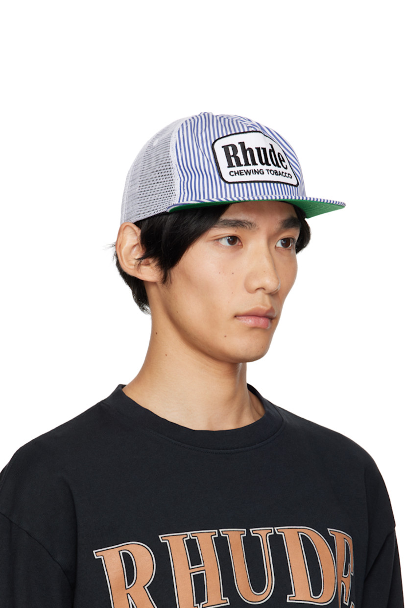 Paneled mesh and plain-woven cap. 

· Embroidered eyelets at crown 
· Stripes and embroidered logo patch at face
· Flat brim 
· Snapback fastening at back
· Twill browband
· Plain-woven lining 

Supplier color: Blue/White