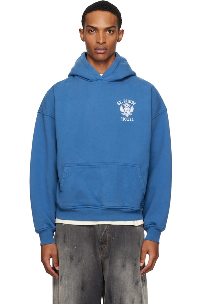 Cotton fleece hoodie.

· Graphic, logo, and text printed at chest and back
· Kangaroo pocket 
· Rib-knit hem and cuffs
· Dropped shoulders 

Supplier color: Royal blue