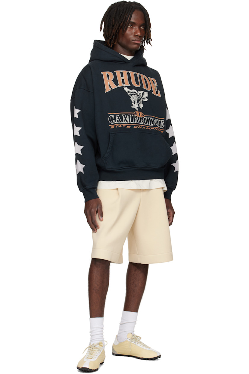 Cotton fleece hoodie.

· Logo, graphic, and text printed at chest 
· Kangaroo pocket
· Rib-knit cuffs and hem 
· Dropped shoulders
· Graphics printed at sleeves

Supplier color: Vintage Black