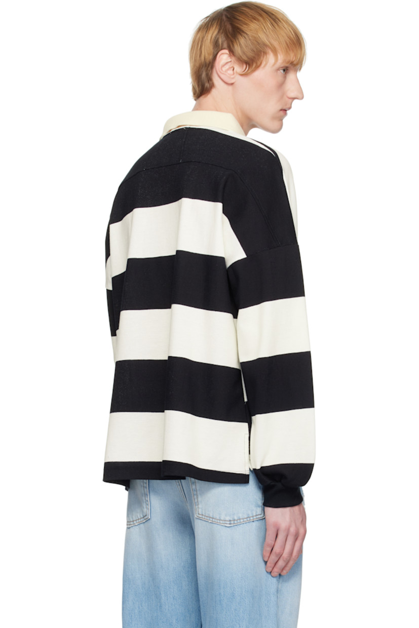 Cotton piqué polo. Stripes throughout. 

· Rib-knit spread collar and cuffs
· Concealed three-button placket
· Logo embroidered at chest
· Tennis-tail hem
· Dropped shoulders

Supplier color: White/Black