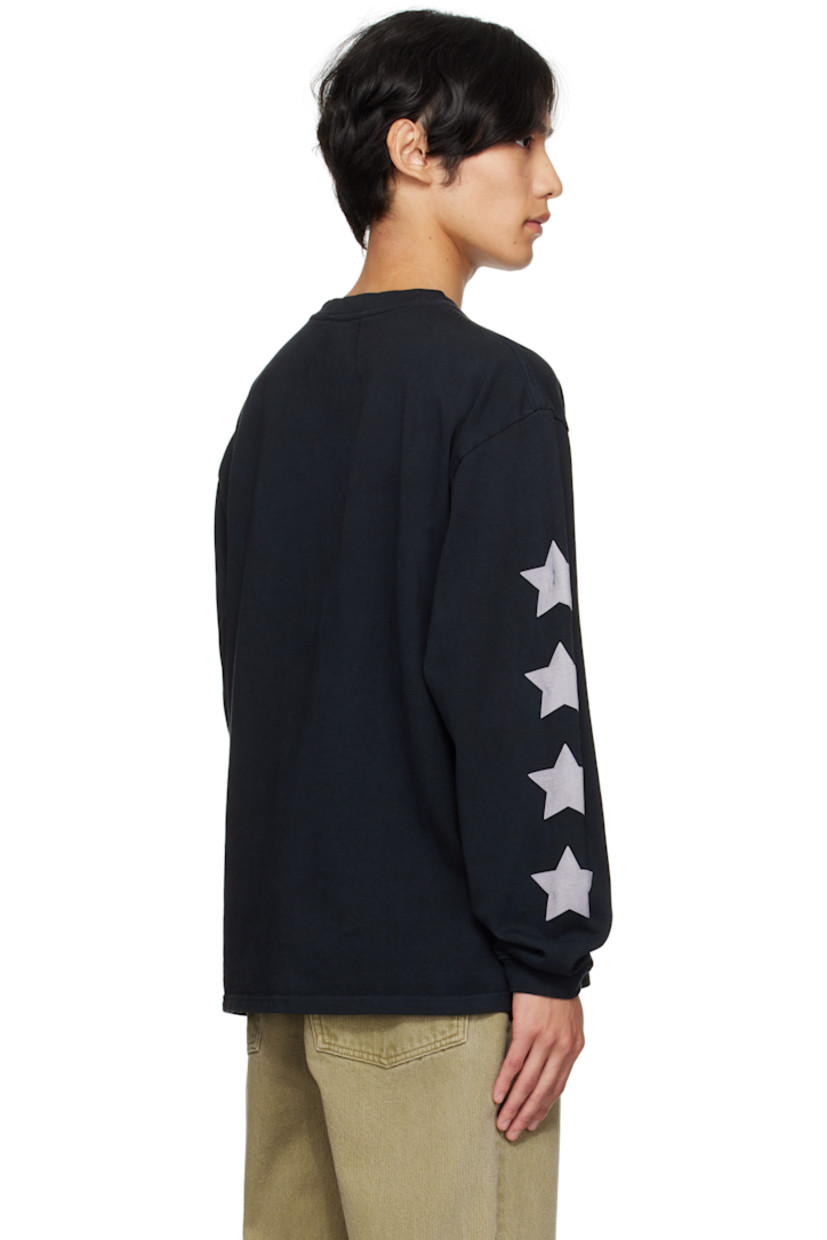 Cotton jersey T-shirt.

· Rib-knit crewneck and cuffs
· Logo, graphic, and text printed at front
· Graphics printed at sleeves
· Dropped shoulders

Supplier color: Vintage black