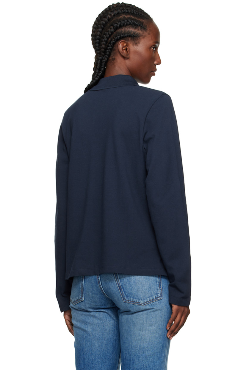Organic cotton jersey polo.

· Rib-knit spread collar
· Three-button placket
· Vents at hem
· Mother-of-pearl hardware

Supplier color: Navy