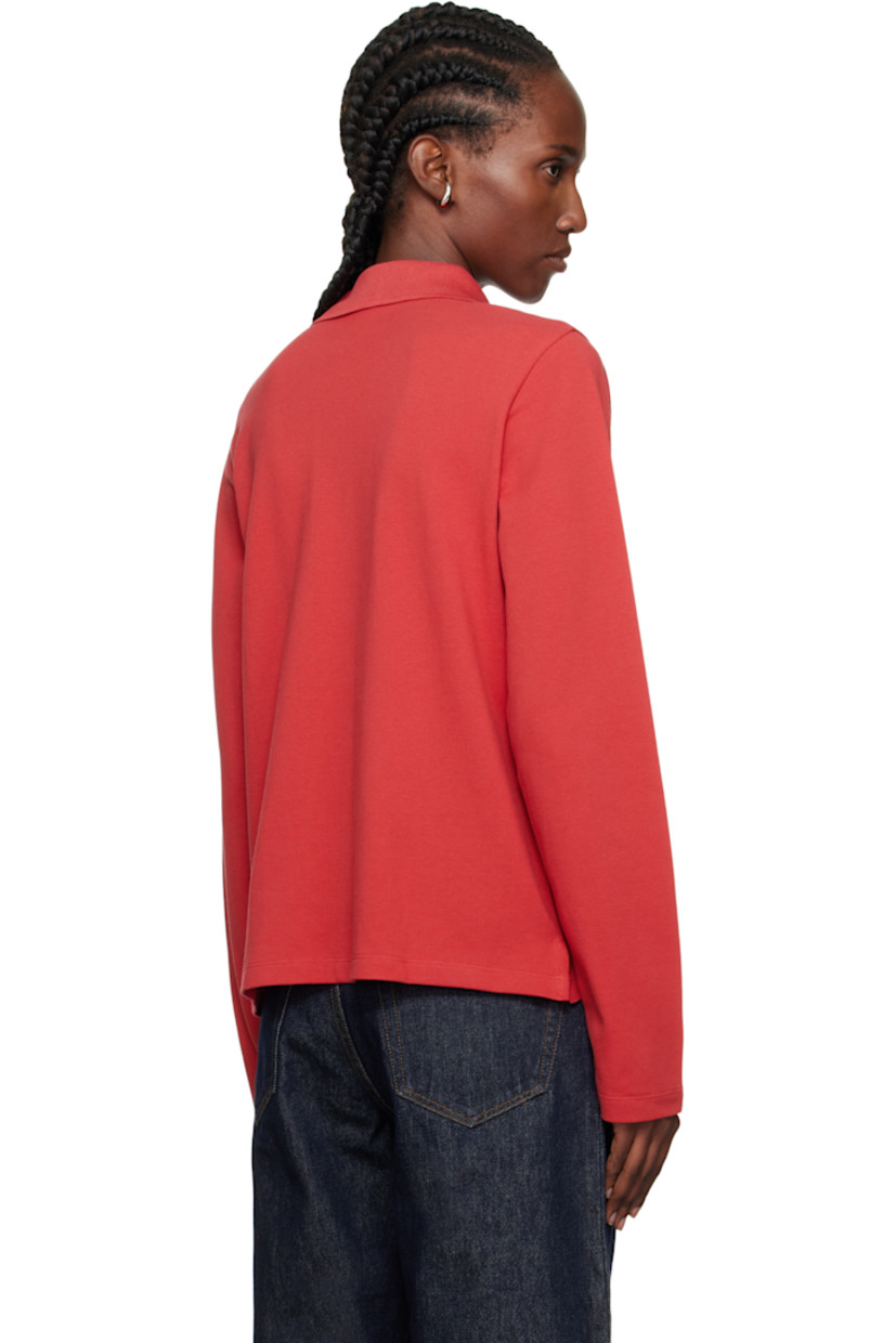 Organic cotton jersey polo.

· Rib-knit spread collar
· Three-button placket
· Vents at hem
· Mother-of-pearl hardware

Supplier color: Raspberry