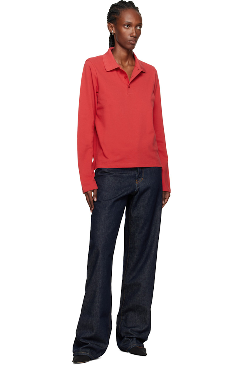 Organic cotton jersey polo.

· Rib-knit spread collar
· Three-button placket
· Vents at hem
· Mother-of-pearl hardware

Supplier color: Raspberry