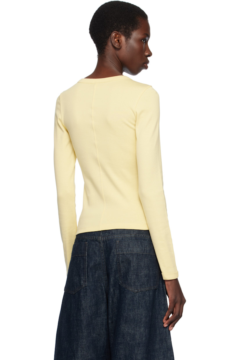 Organic cotton jersey T-shirt.

· Rib-knit crewneck and cuffs
· Central seam at back

Supplier color: Butter