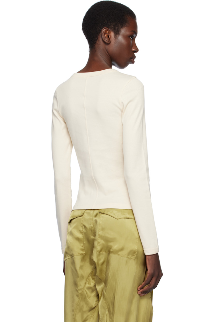 Organic cotton jersey T-shirt.

· Rib-knit crewneck and cuffs
· Central seam at back

Supplier color: Off white