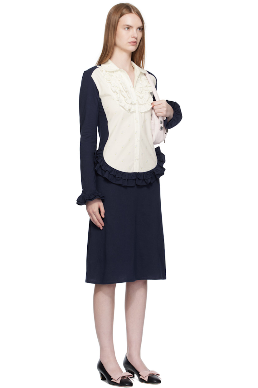 Cotton jersey midi dress.

· Paneled construction
· Floral pattern printed at poplin panel
· Peter Pan collar 
· Six-button placket
· Ruffles at chest, waist, and cuffs

Supplier color: Tissue paper