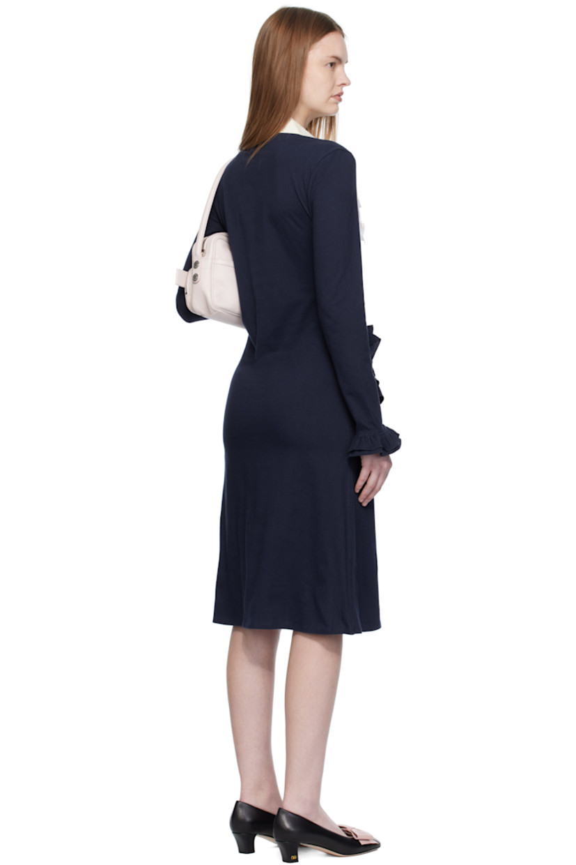 Cotton jersey midi dress.

· Paneled construction
· Floral pattern printed at poplin panel
· Peter Pan collar 
· Six-button placket
· Ruffles at chest, waist, and cuffs

Supplier color: Tissue paper