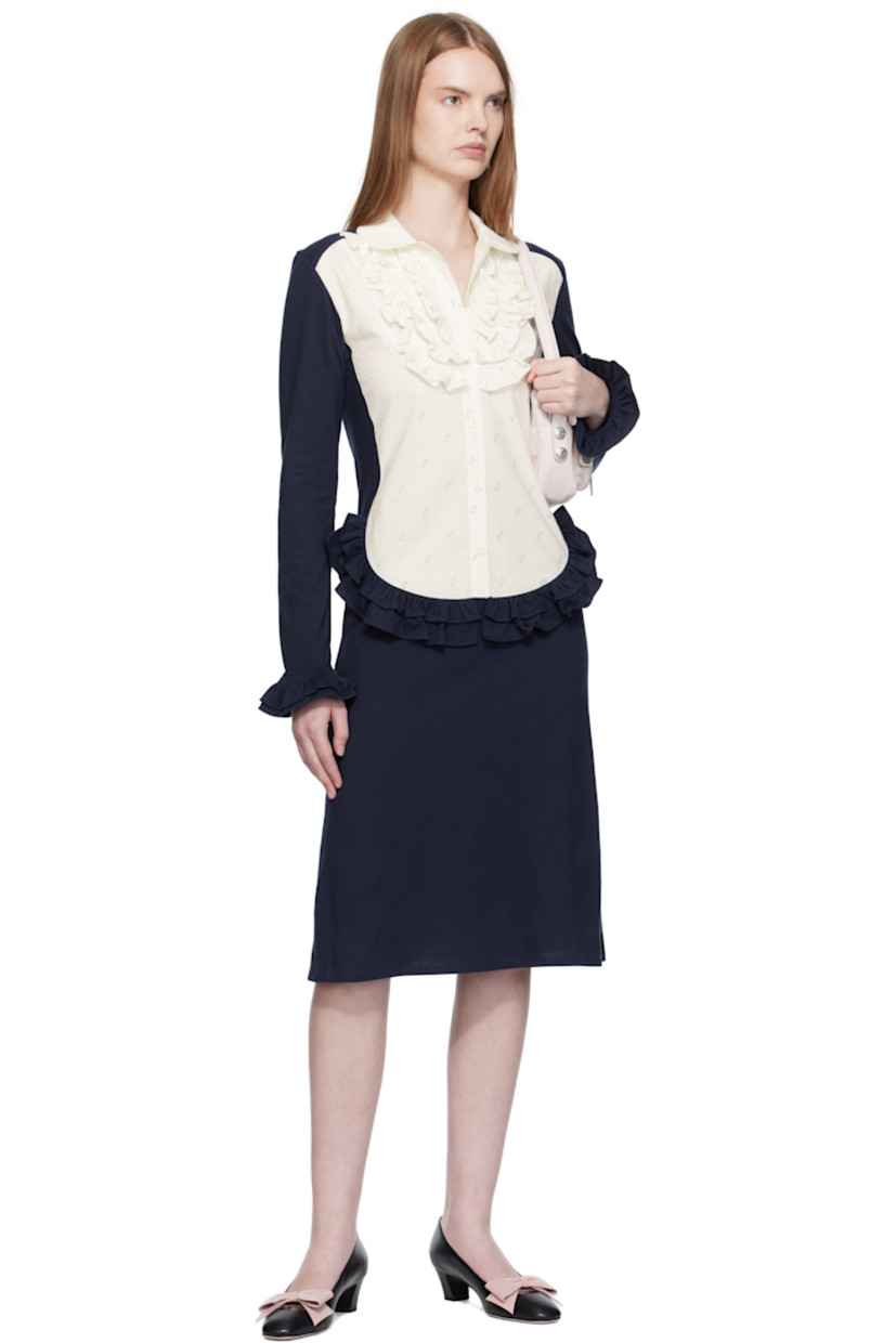 Cotton jersey midi dress.

· Paneled construction
· Floral pattern printed at poplin panel
· Peter Pan collar 
· Six-button placket
· Ruffles at chest, waist, and cuffs

Supplier color: Tissue paper