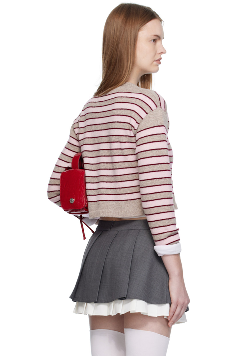 Knit lambswool sweater. 

· Jacquard stripes throughout 
· Rib-knit V-neck, hem, and cuffs
· Cropped hem
· Dropped shoulders

Supplier color: Stripe