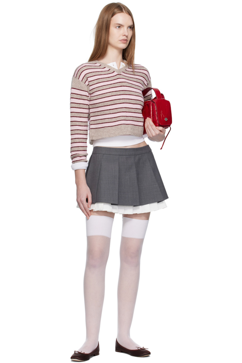 Knit lambswool sweater. 

· Jacquard stripes throughout 
· Rib-knit V-neck, hem, and cuffs
· Cropped hem
· Dropped shoulders

Supplier color: Stripe