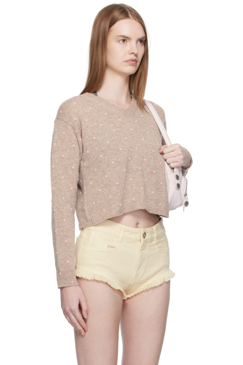 Knit lambswool sweater. 

· Polka-dot pattern bonded throughout 
· Rib-knit V-neck, hem, and cuffs
· Cropped hem
· Dropped shoulders

Supplier color: Pink polka dot