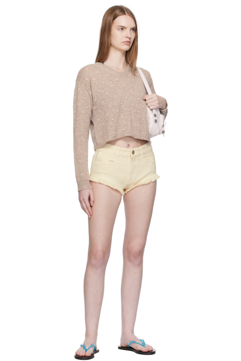 Knit lambswool sweater. 

· Polka-dot pattern bonded throughout 
· Rib-knit V-neck, hem, and cuffs
· Cropped hem
· Dropped shoulders

Supplier color: Pink polka dot