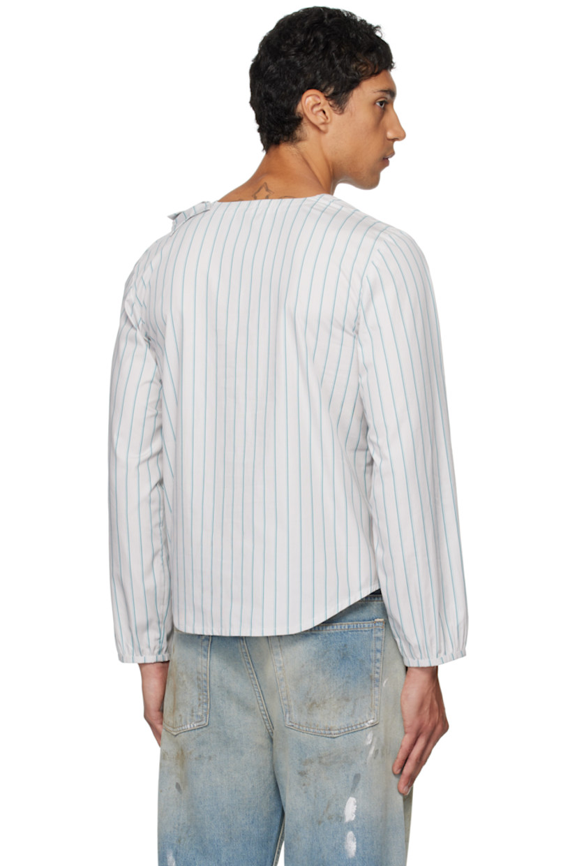 Cotton poplin henley.

· Stripes throughout 
· Round neck
· Bow appliqué at chest
· Four-button placket 
· Shirttail hem 
· Elasticized cuffs

Supplier color: Stripe