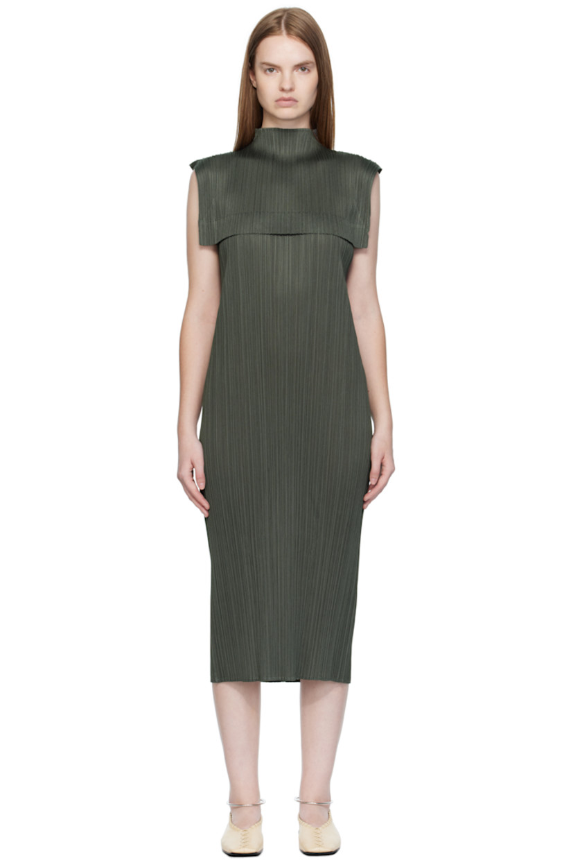 Garment-pleated tricot maxi dress. 

· Semi-sheer
· Mock neck 
· Fixed overlay panel at chest

Supplier color: Charcoal gray