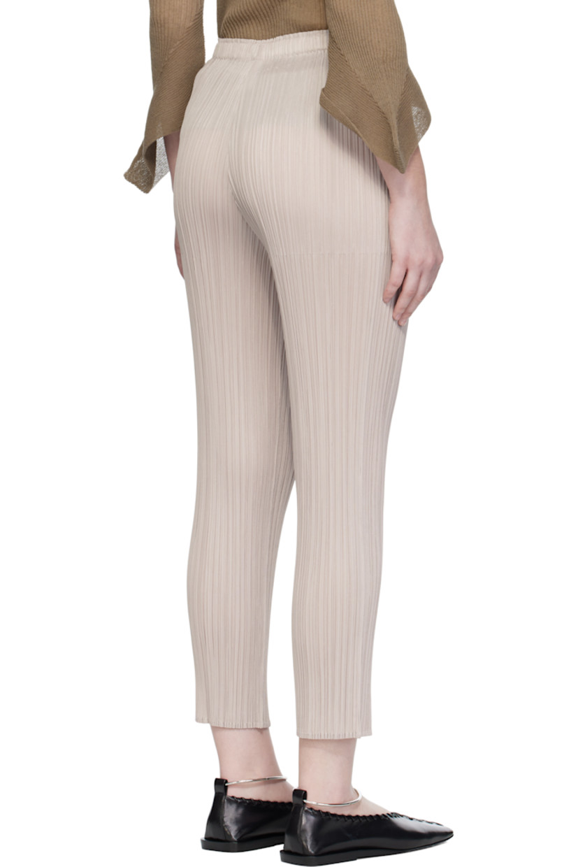 Garment-pleated tricot trousers.

· Straight-leg
· Elasticized waistband
· Two-pocket styling

Supplier color: Greige