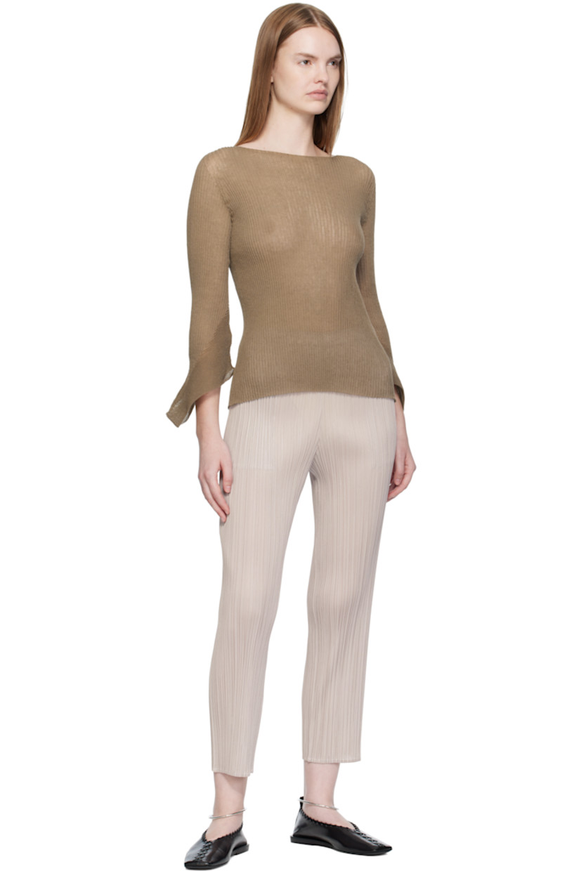 Garment-pleated tricot trousers.

· Straight-leg
· Elasticized waistband
· Two-pocket styling

Supplier color: Greige