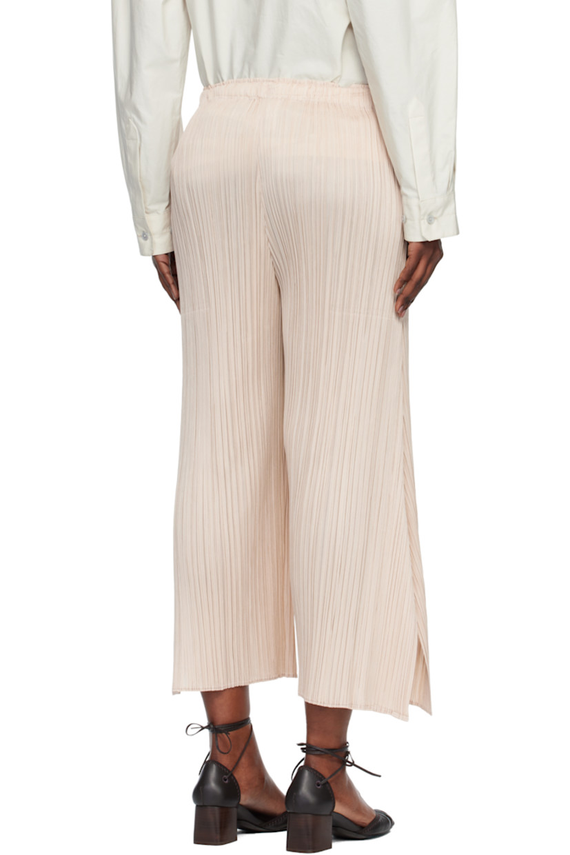 Garment-pleated tricot trousers.

· Straight-leg 
· Elasticized waistband
· Two-pocket styling

Supplier color: Light beige