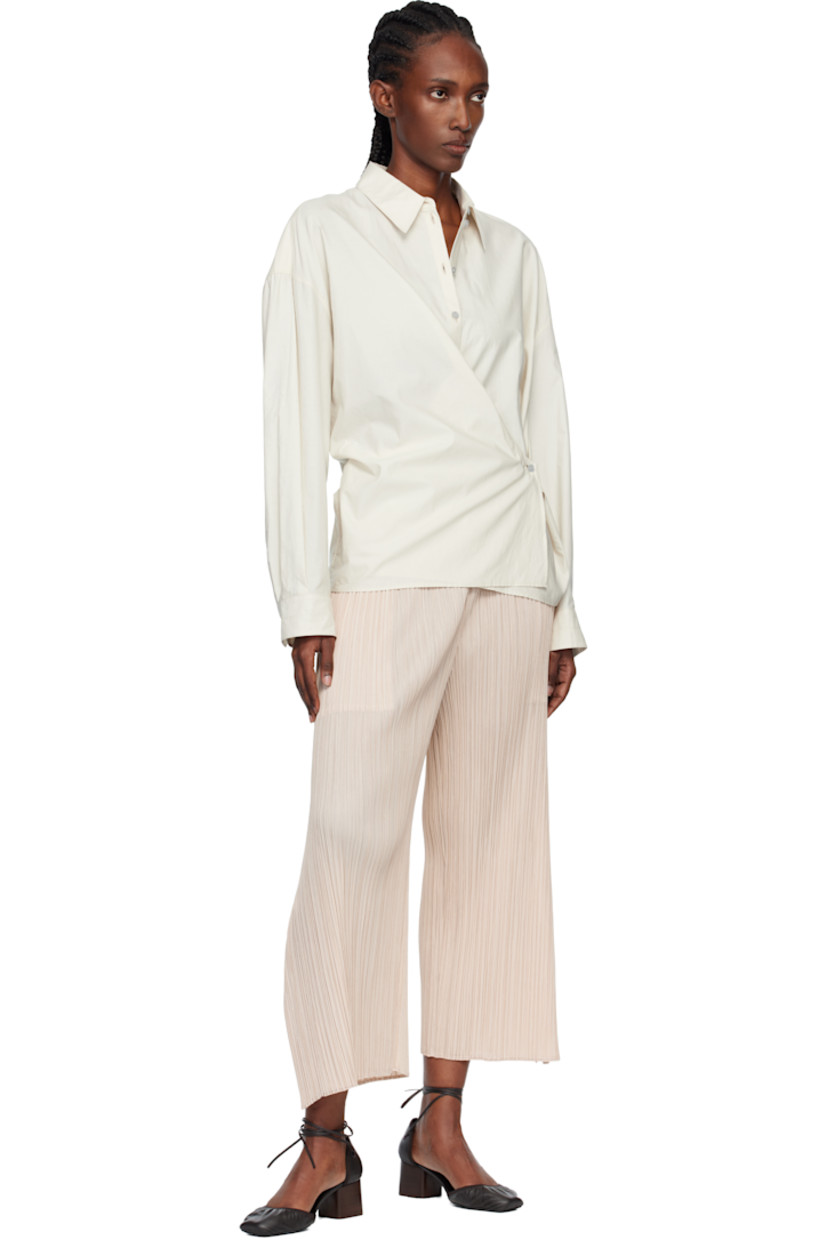 Garment-pleated tricot trousers.

· Straight-leg 
· Elasticized waistband
· Two-pocket styling

Supplier color: Light beige