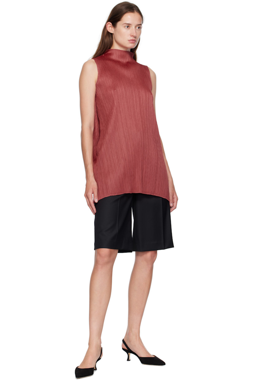 Garment-pleated tricot top. Mock neck.

Supplier color: Dark red