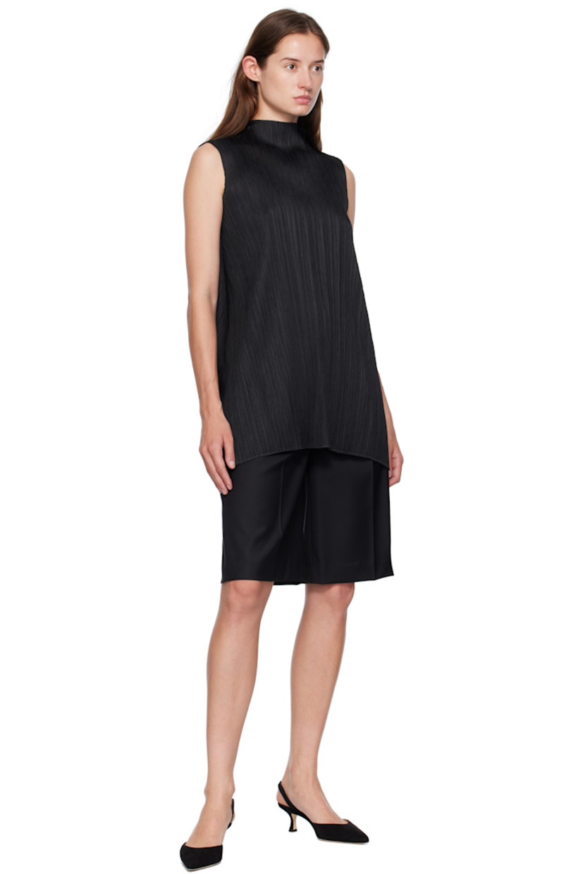 Garment-pleated tricot top. Mock neck.

Supplier color: Black