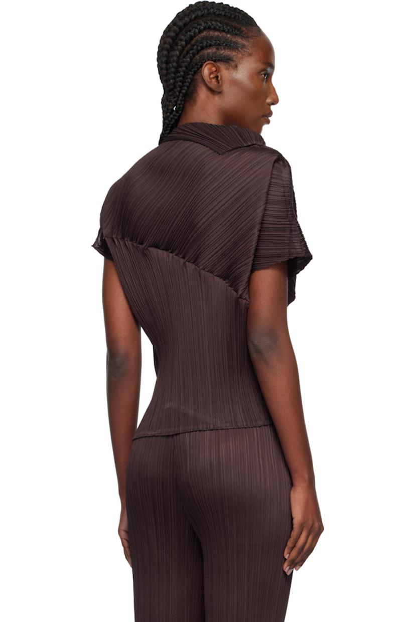 Garment-pleated tricot top.

· Foldover neck
· Asymmetrical hem and cap sleeves

Supplier color: Dark brown