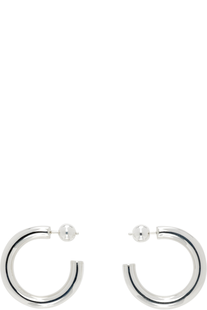 Pair of handcrafted open hoop earrings in sterling silver. 

· Post-stud fastening 
· D1"

Supplier color: Sterling silver