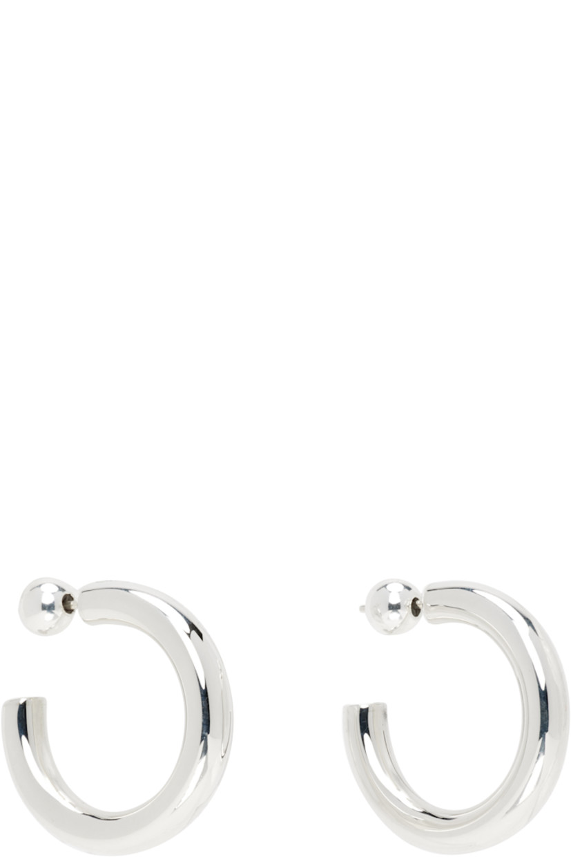 Pair of handcrafted open hoop earrings in sterling silver. 

· Post-stud fastening 
· D1"

Supplier color: Sterling silver