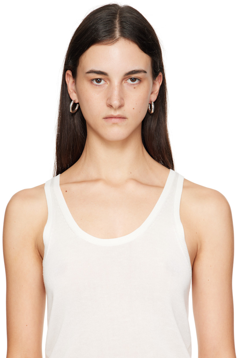 Pair of handcrafted open hoop earrings in sterling silver. 

· Post-stud fastening 
· D1"

Supplier color: Sterling silver
