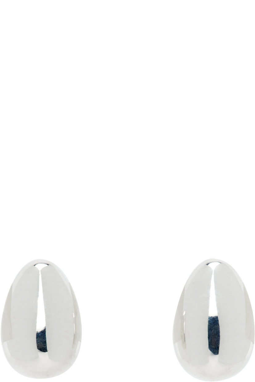 Pair of handcrafted stud earrings in sterling silver.

· Post-stud fastening
· H0.25" x W0.25"

Supplier color: Sterling silver