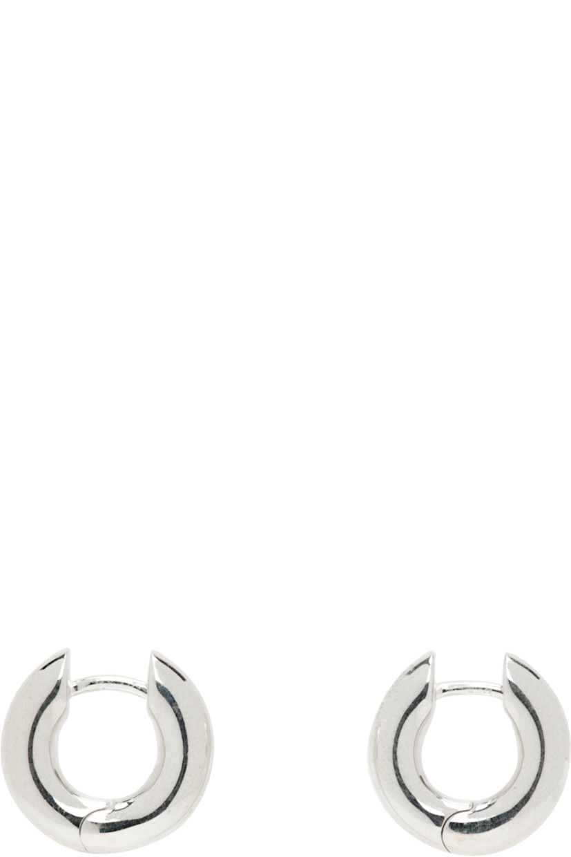 Pair of handcrafted hoop earrings in sterling silver. 

· Hinged-post fastening 
· D0.5"

Supplier color: Sterling silver