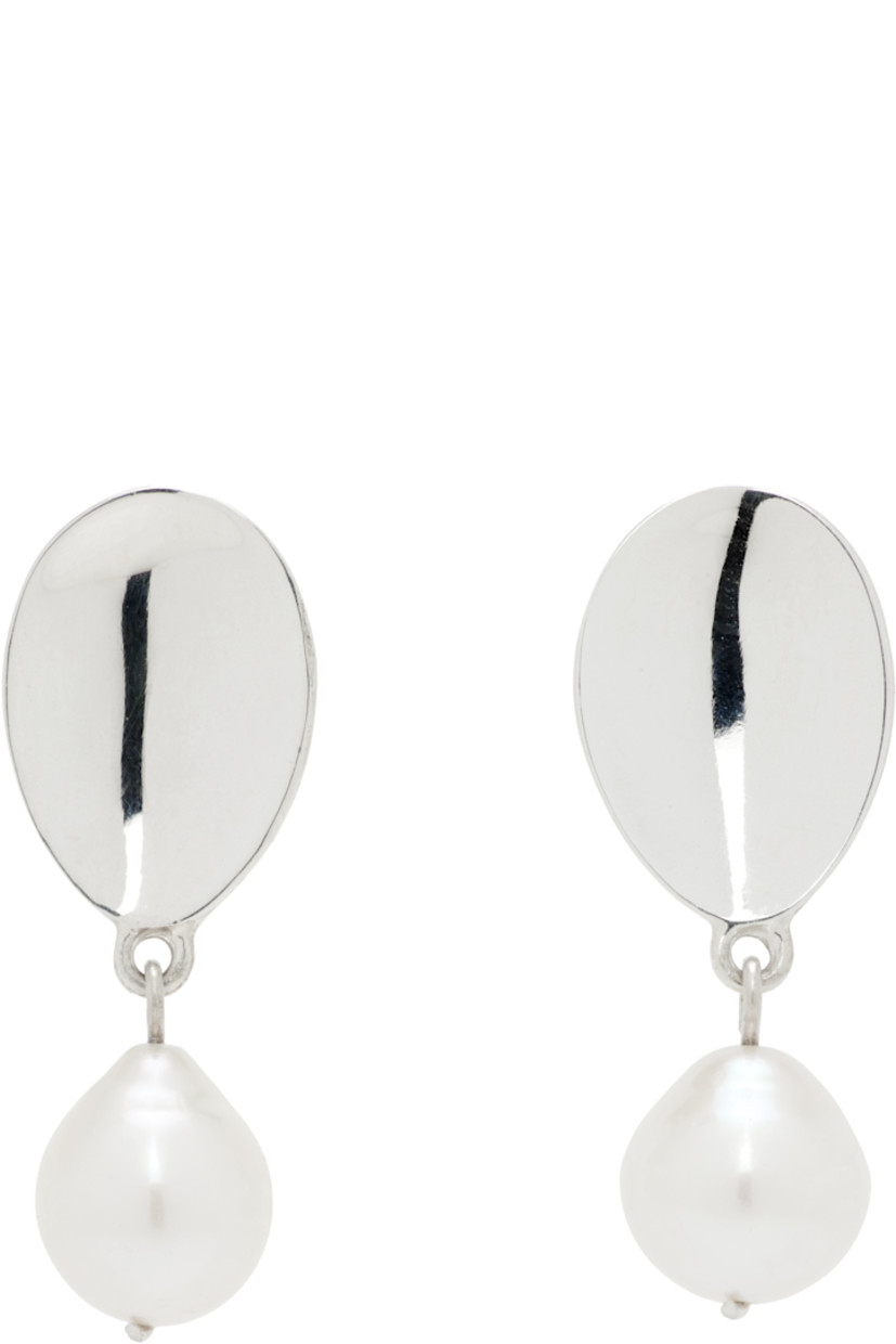 Pair of handcrafted drop earrings in sterling silver.

· Freshwater pearl at drop
· Post-stud fastening
· H1" x W0.5"

Supplier color: Sterling silver