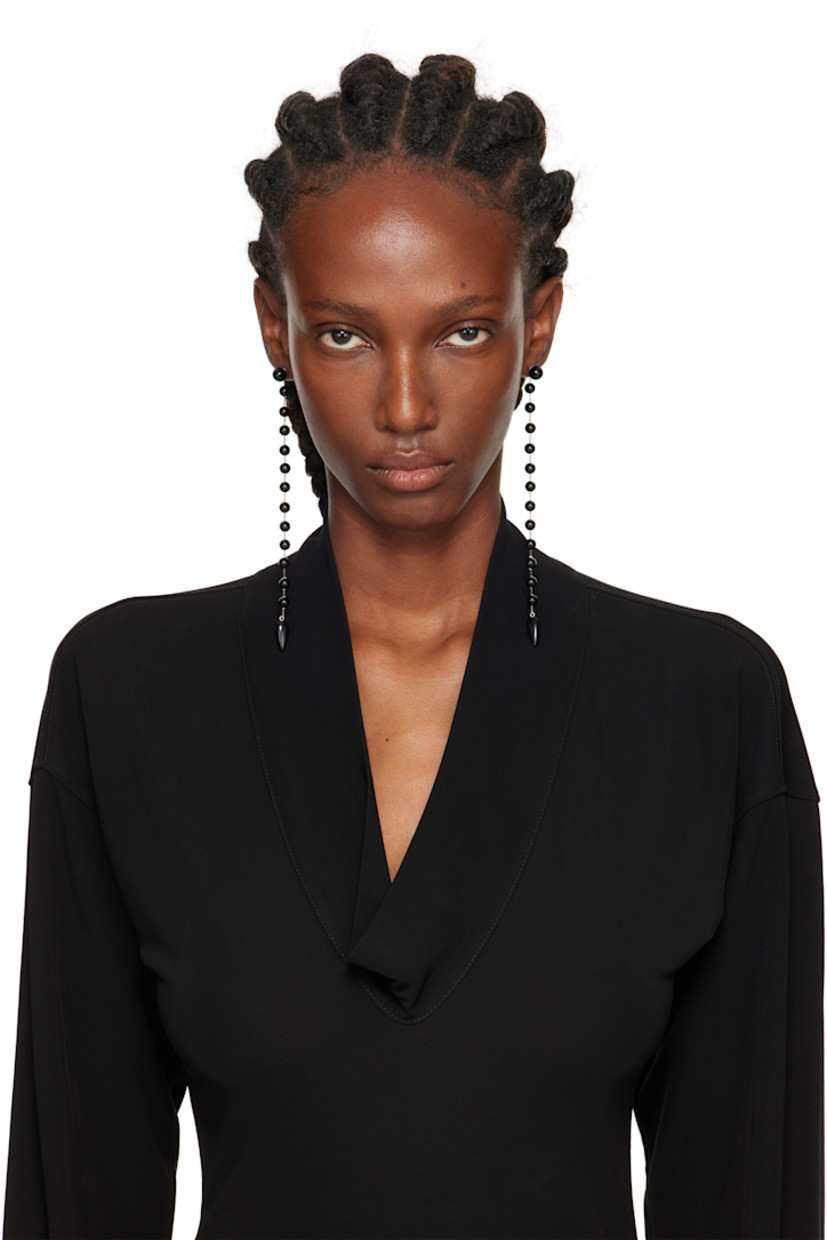 Pair of handcrafted cable chain drop earrings in sterling silver. 

· Black onyx beads at drop
· Post-stud fastening 
· H6" x W0.5" 

Supplier color: Onyx