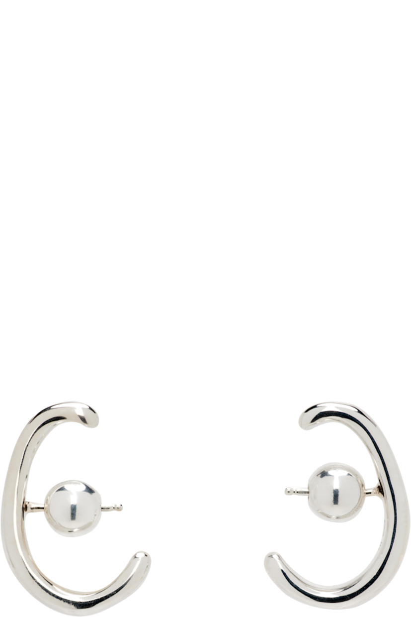 Pair of handcrafted stud earrings in sterling silver. 

· Post-stud fastening 
· H1" x W0.25"

Supplier color: Sterling silver
