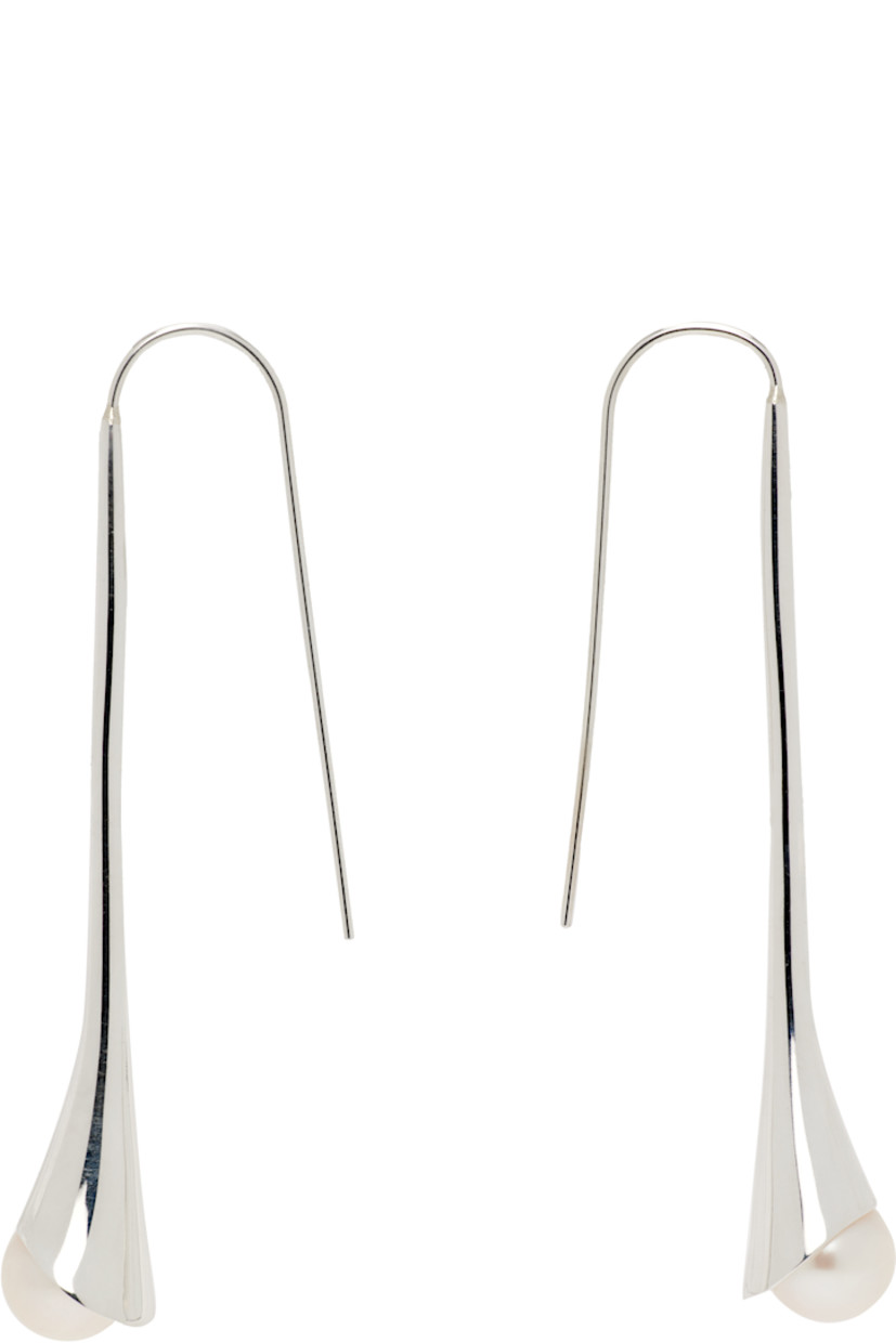 Pair of handcrafted drop earrings in sterling silver. 

· Freshwater pearl at drop 
· French-hook fastening
· H2.25" x W0.5"

Supplier color: White pearl