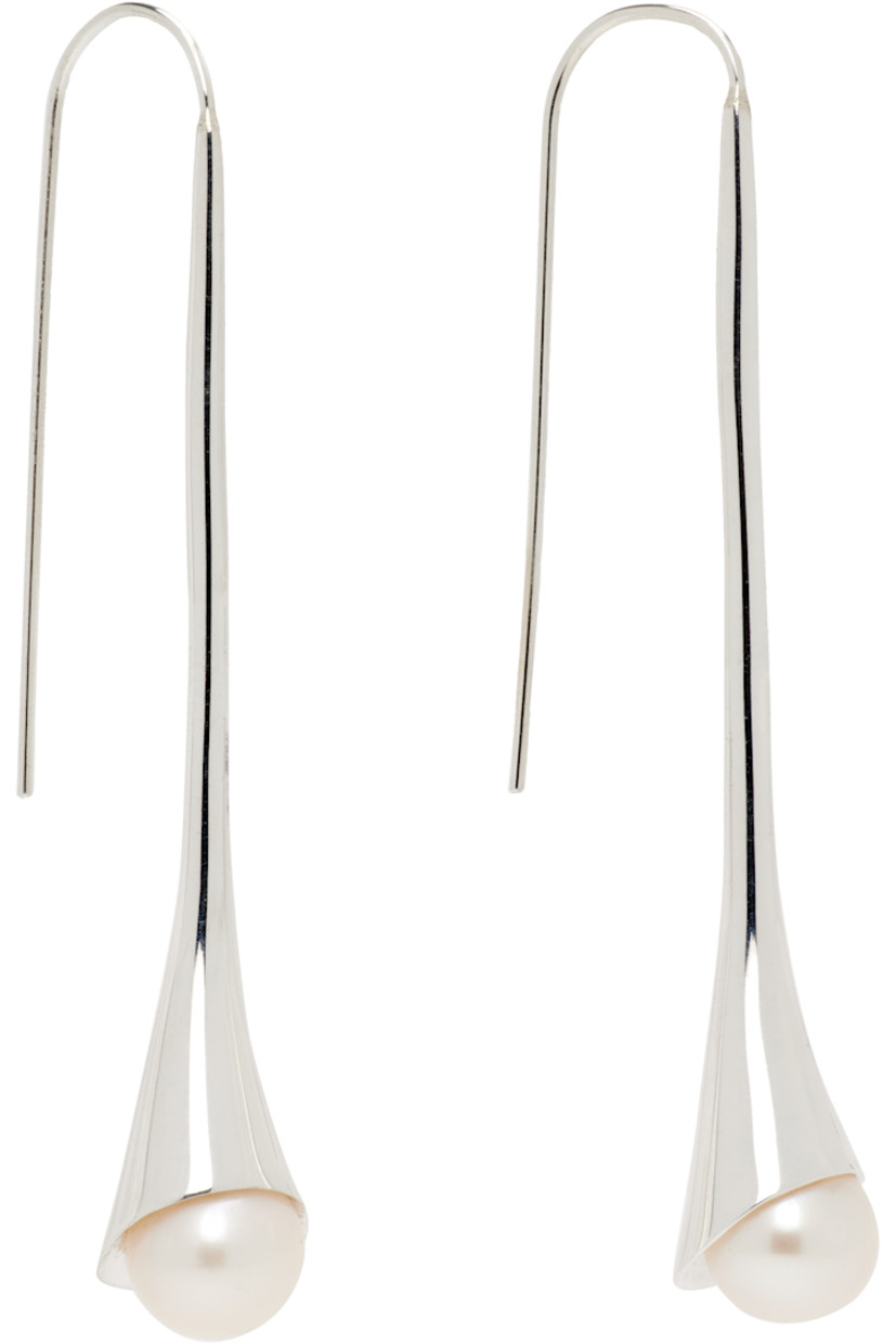 Pair of handcrafted drop earrings in sterling silver. 

· Freshwater pearl at drop 
· French-hook fastening
· H2.25" x W0.5"

Supplier color: White pearl